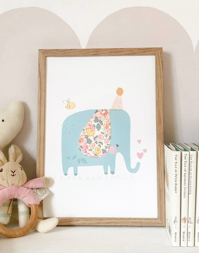 Elephant nursery art with Liberty print details.