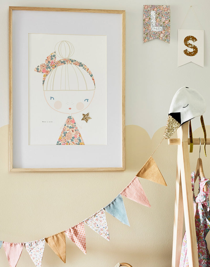 Liberty print Fairy with glitter wand nursery art by The Charming Press shown in children's bedroom.