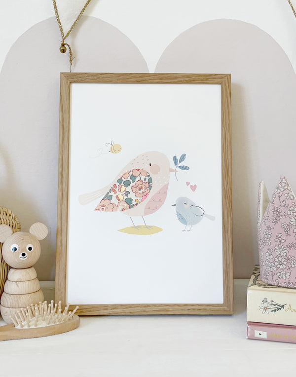 Bird nursery print by The Charming Press shown on nursery shelf.