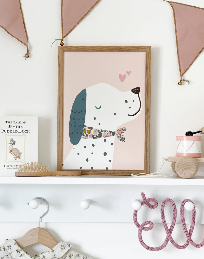 Liberty Puppy dog print by The Charming Press shown on nursery shelf. 