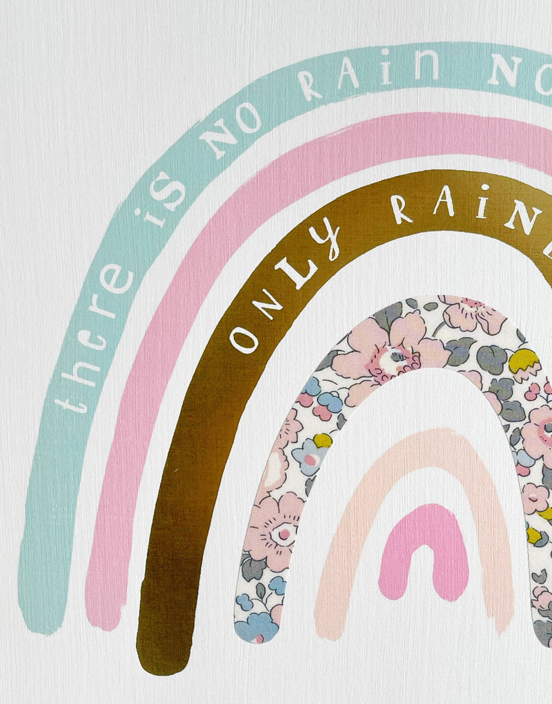Close up of Liberty and gold foil detail on pastel rainbow nursery wall art by The Charming Press