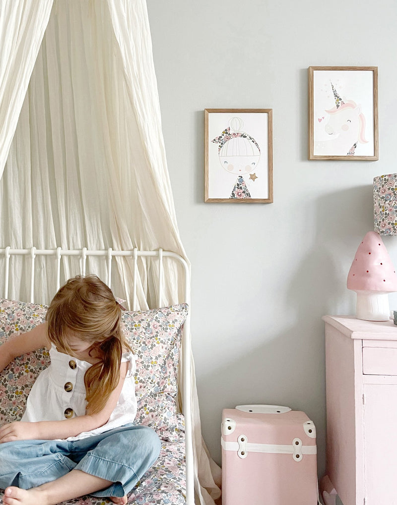 Gallery wall in nursery with unicorn and fairy Liberty print art by The Charming Press