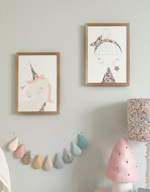 Children's bedroom gallery wall with unicorn and fairy prints by The Charming Press