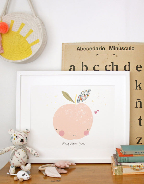 Peach Nursery Print by The Charming Press shown on child's bedroom desk.
