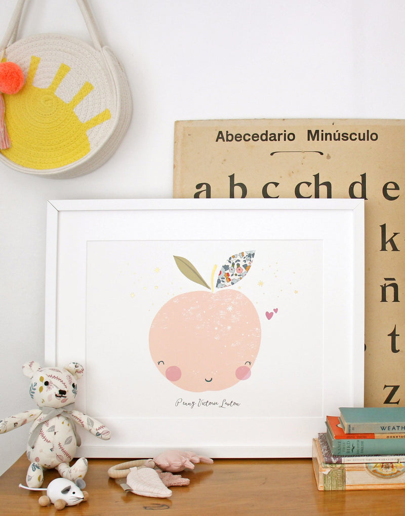 Peach Nursery Print by The Charming Press shown on child's bedroom desk.