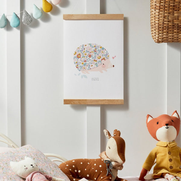 Liberty print hedgehog nursery print by The Charming Press hanging in child's bedroom