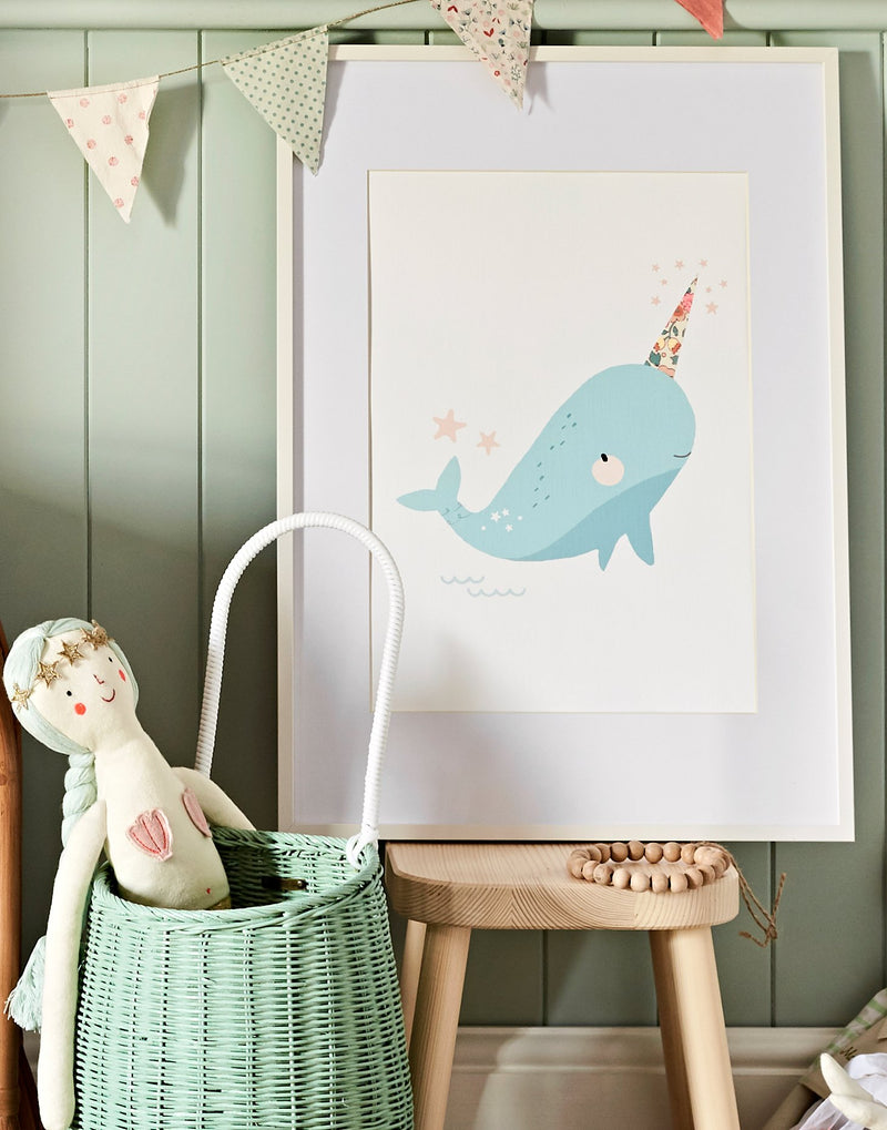 Liberty print Narwhal nursery art by The Charming Press shown in children's bedroom.
