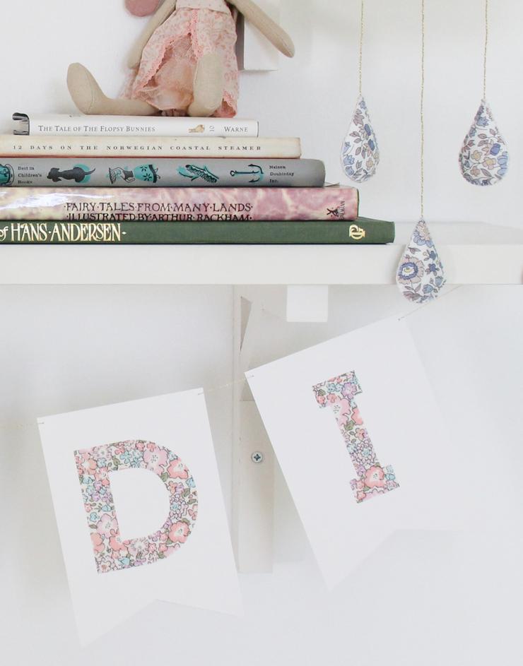 Detail of Liberty print letters of The Charming Press nursery bunting.