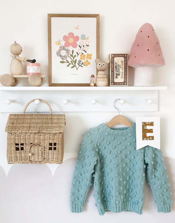 Children's bedroom shelf, styled with floral print by The Charming Press and Liberty fabric mini monogram flag, personalised with child's initial.