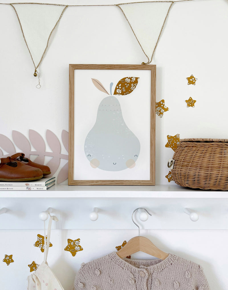 Pear nursery print by The Charming Press with Liberty print details shown in children's bedroom.