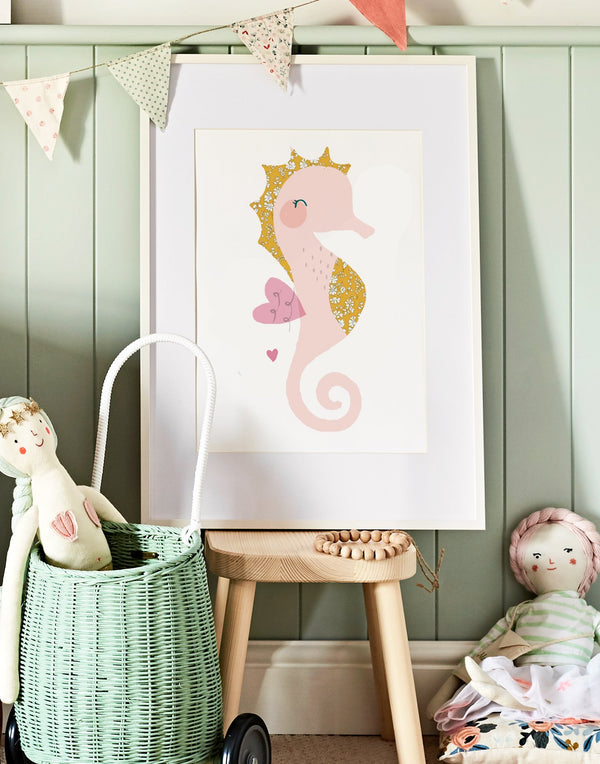 Liberty print nursery art featuring a seahorse, shown in a girl's bedroom. 