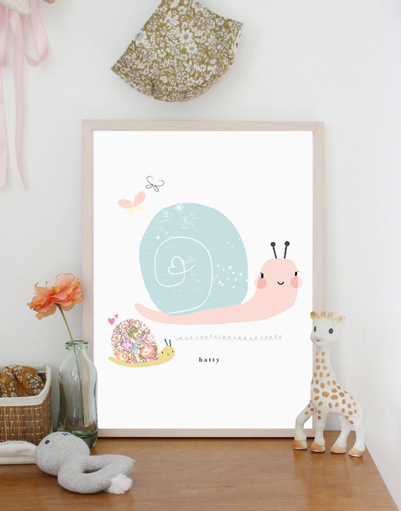Snail nursery print with Liberty fabric details by The Charming Press in child's bedroom.
