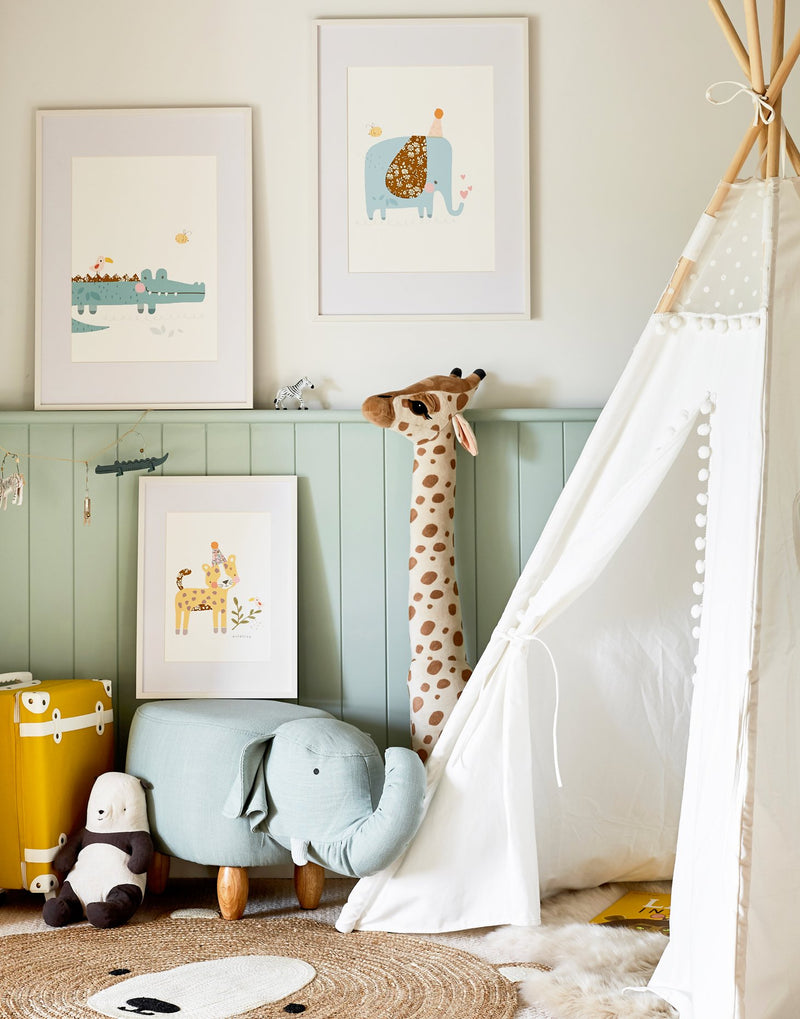 Children's safari gallery wall featuring Liberty print animal art work from The Charming Press