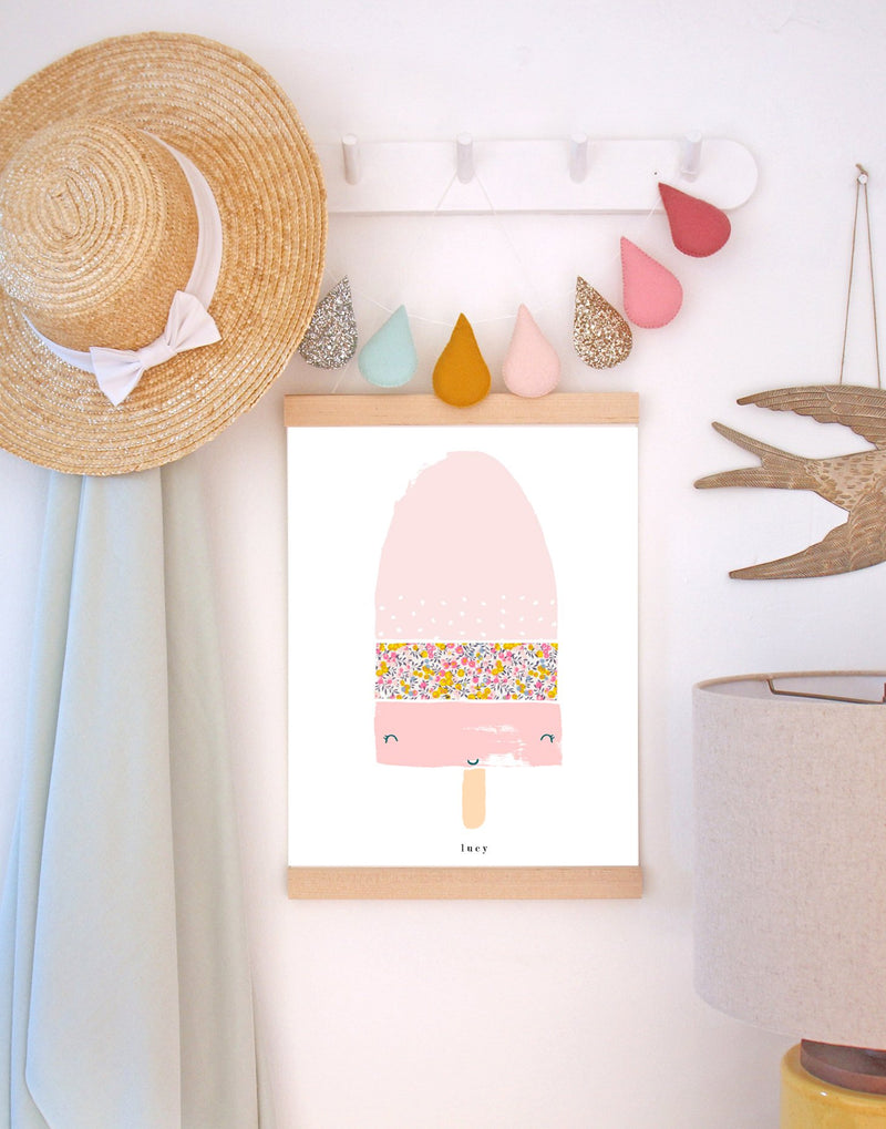 Nursery peg shelf with hanging print by The Charming Press featuring a Liberty print lolly. 