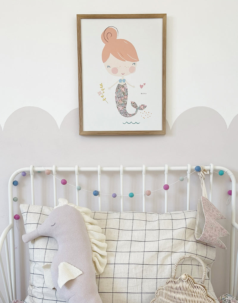 Child's bedroom with Mermaid print on the wall