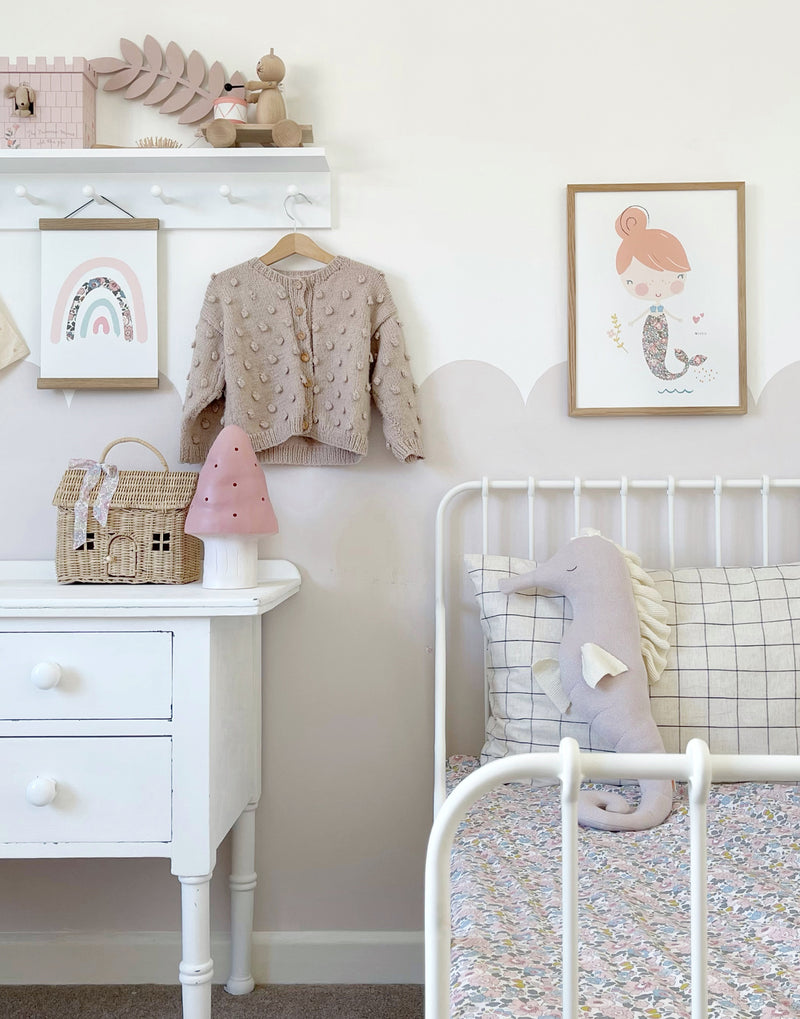 Girls' bedroom with Mermaid and Rainbow wall art by The Charming Press. 