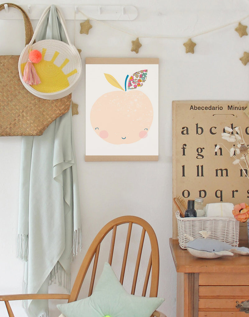 Children's bedroom with fruit nursery wall art made using Liberty fabrics by The Charming Press hanging. 